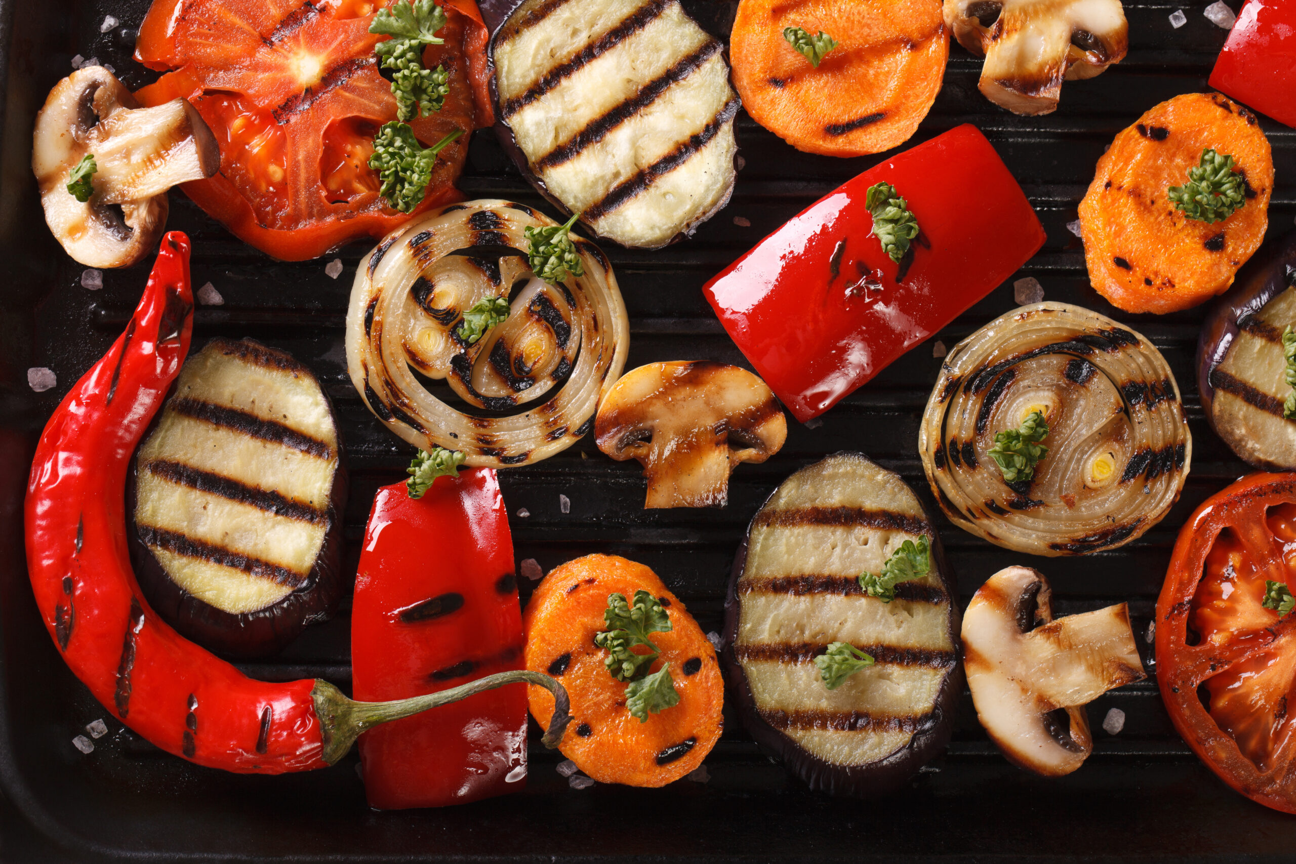 Background of grilled vegetables on grill horizontal top view